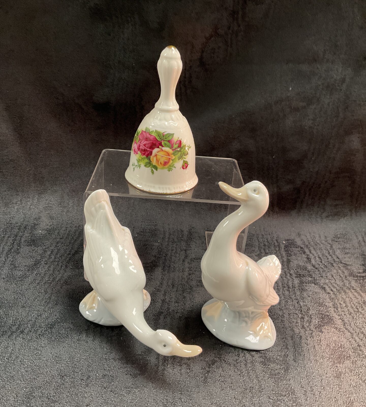 Royal Albert Old Country Rose bell with Lladro geese figurines.