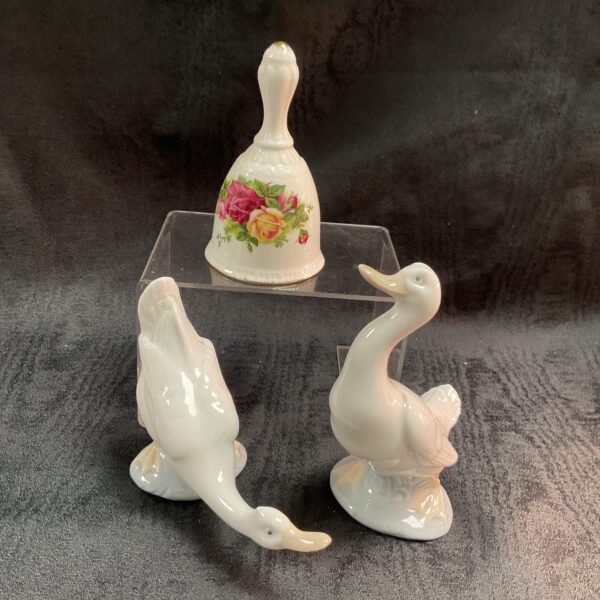 Royal Albert Old Country Rose bell with Lladro geese figurines.