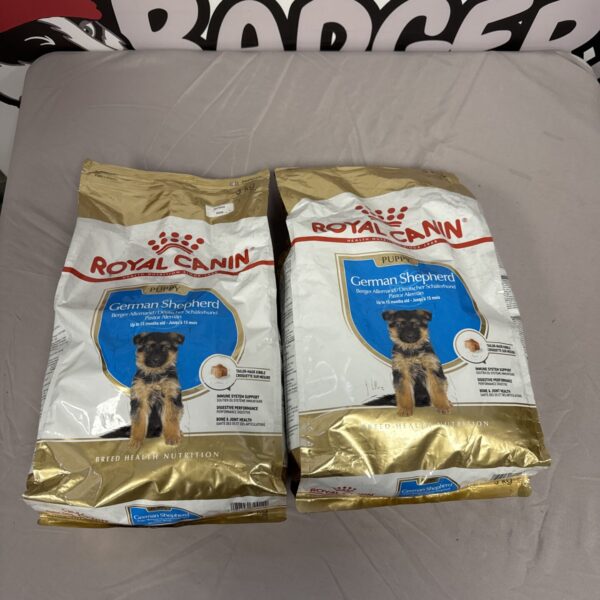 Sealed bags of Royal Canin German Shepherd puppy kibble for growing dogs.