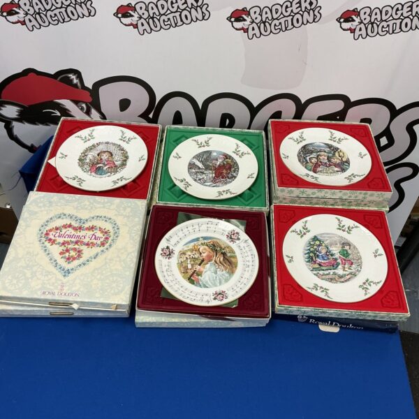 Royal Doulton collectible plates featuring Christmas and Valentine's Day designs.