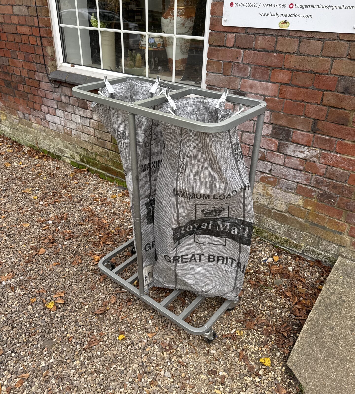 Vintage Royal Mail parcel bag stand with two bags.