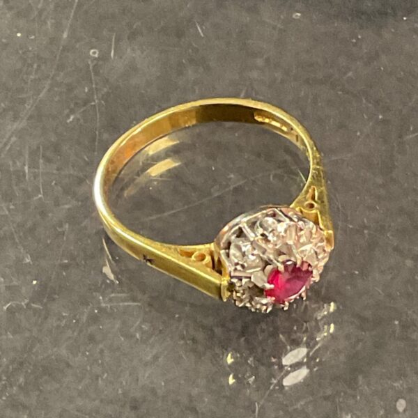 Close-up of a vintage 18 carat gold ruby and diamond ring.