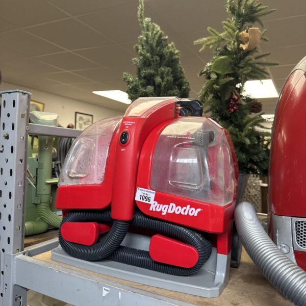 Front view of a Rug Doctor carpet cleaning machine, untested.