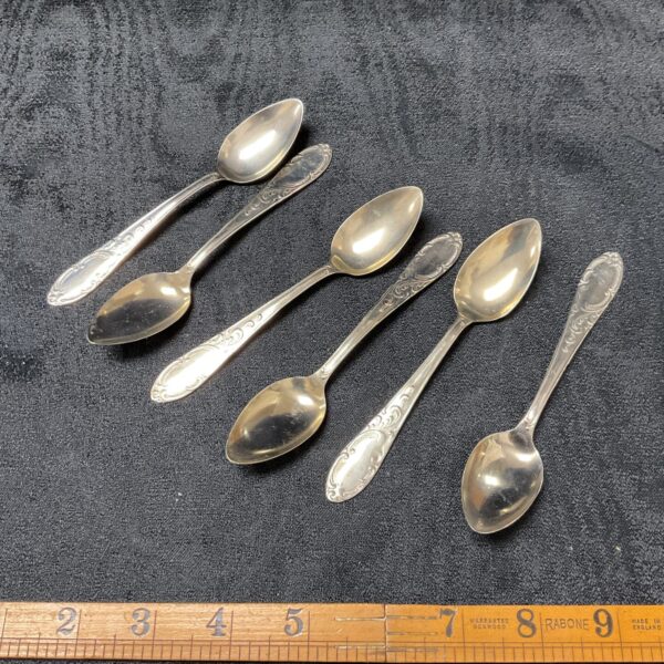 Vintage set of six Russian Neusilber tea spoons with floral detailing.