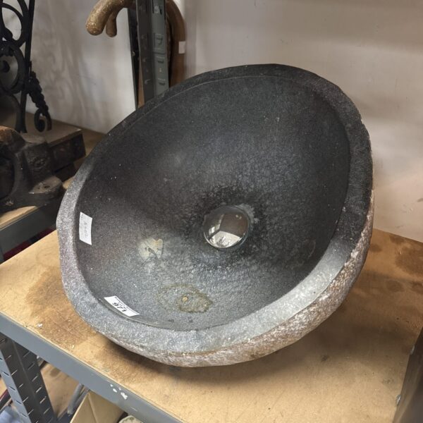 Rustic stoneware wash basin for farmhouse bathroom decor.