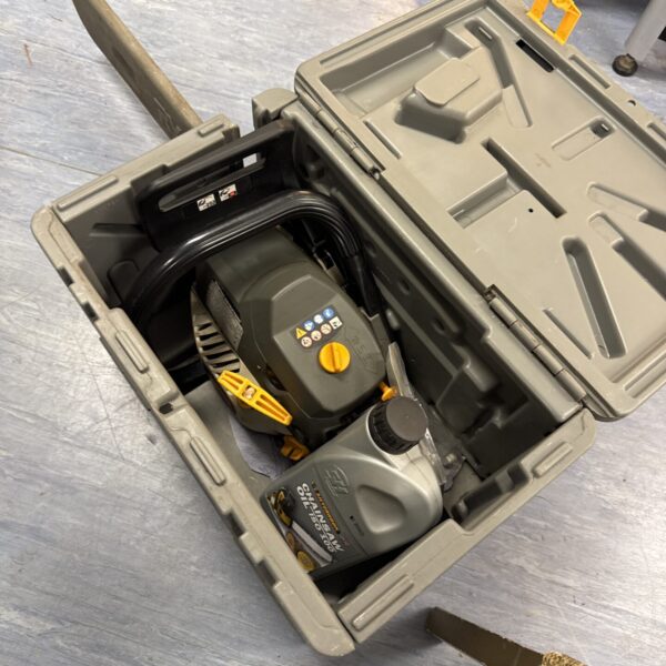 Ryobi petrol chainsaw in its original carry case, untested but with compression.