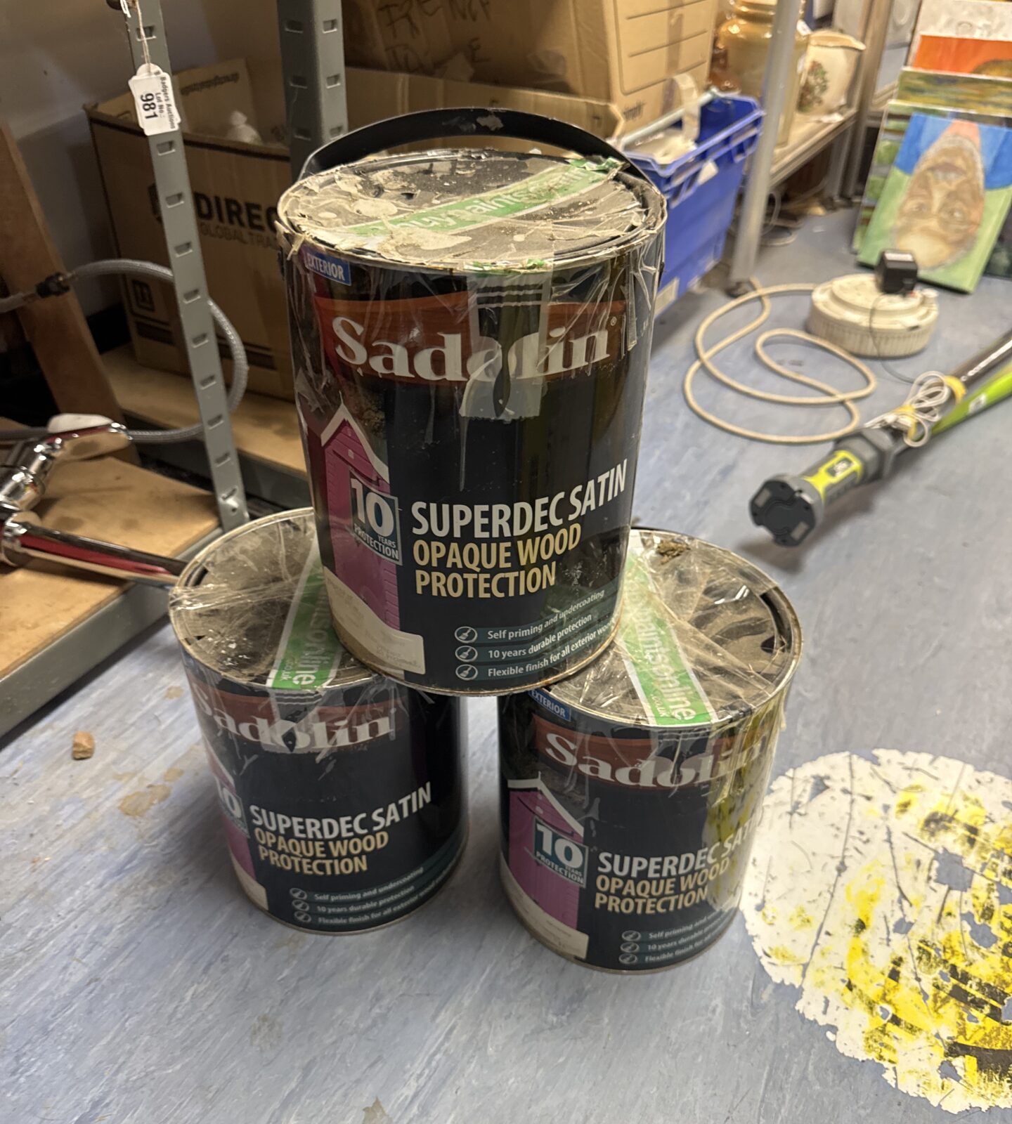 Three full tins of Sadolin Superdec satin opaque wood protection.
