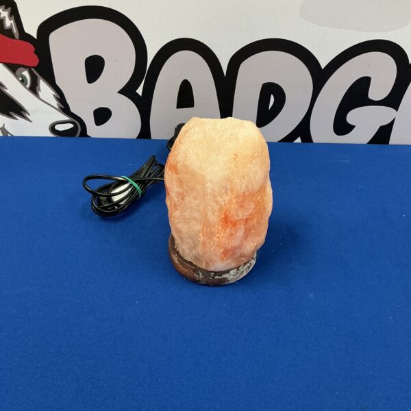 Warm glow from a Himalayan salt crystal lamp for home decor.