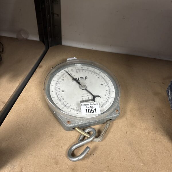 Vintage Salter hanging scales with clear dial and metal construction.