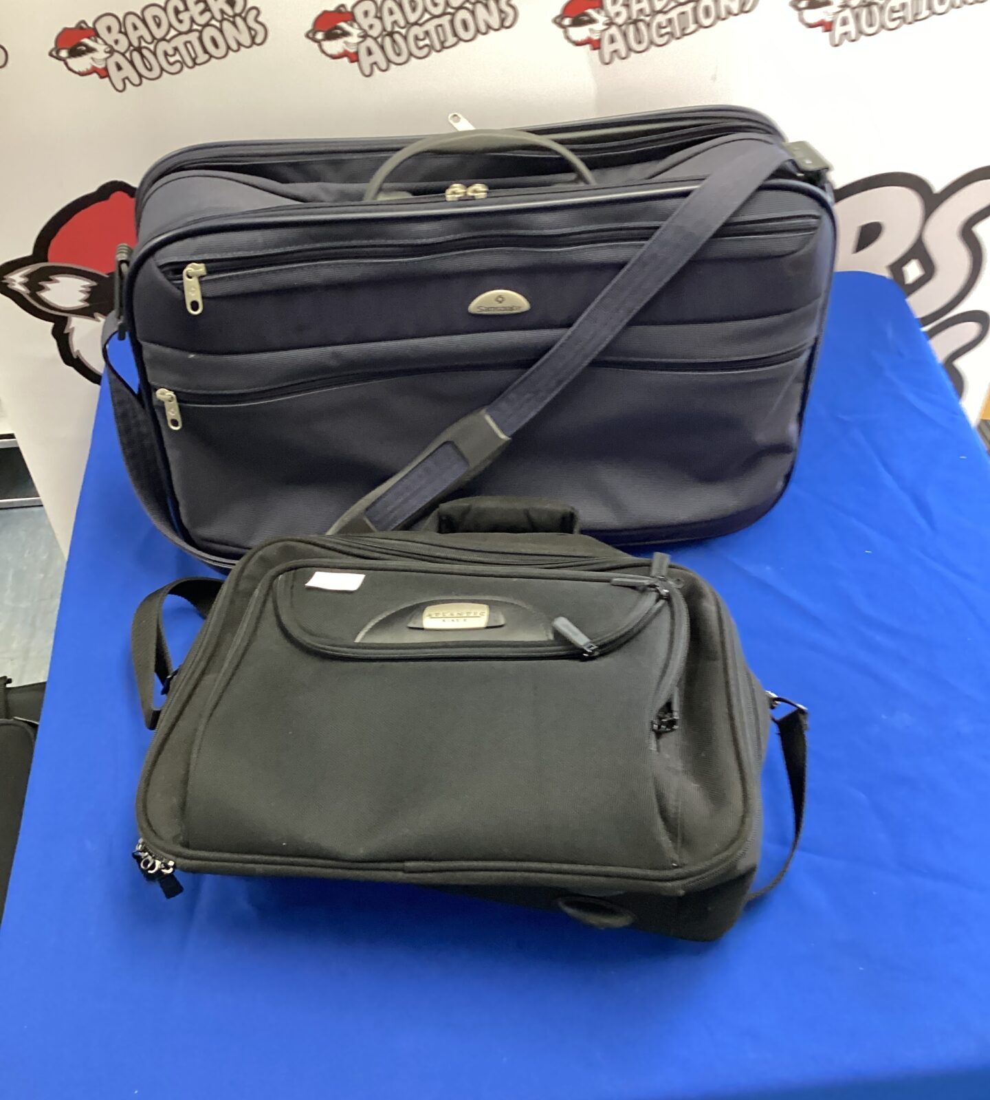 Black Samsonite and Atlantic carry-on luggage set for travel.