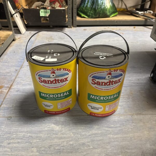 Two tubs of Sandtex Microseal brilliant white masonry paint.