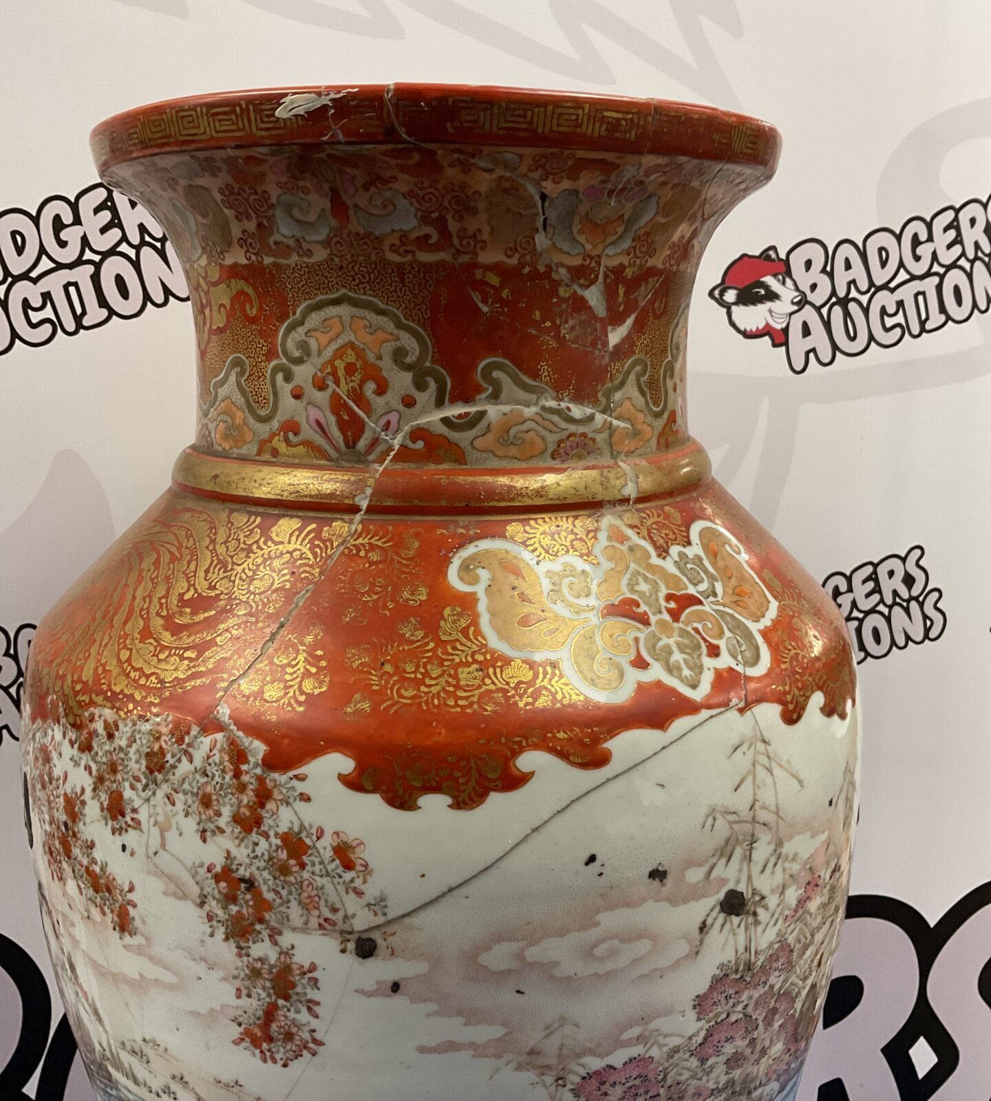 Side view of antique Satsuma vase with colourful painted details.