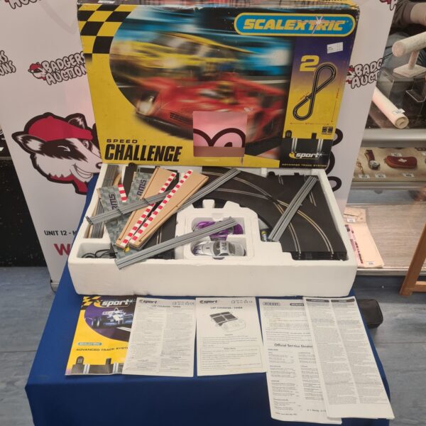 Vintage Scalextric Speed Challenge playset with track pieces.