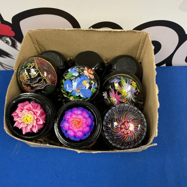 Vintage collection of scented wax flowers in clear cases.