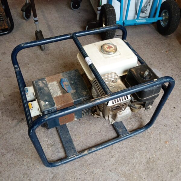 Side view of a used Scorpion petrol generator with metal frame.