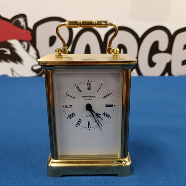 Vintage Selfridges brass carriage clock with Roman numerals.