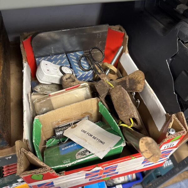 Assorted metal brackets and hardware from a shed clearance lot.