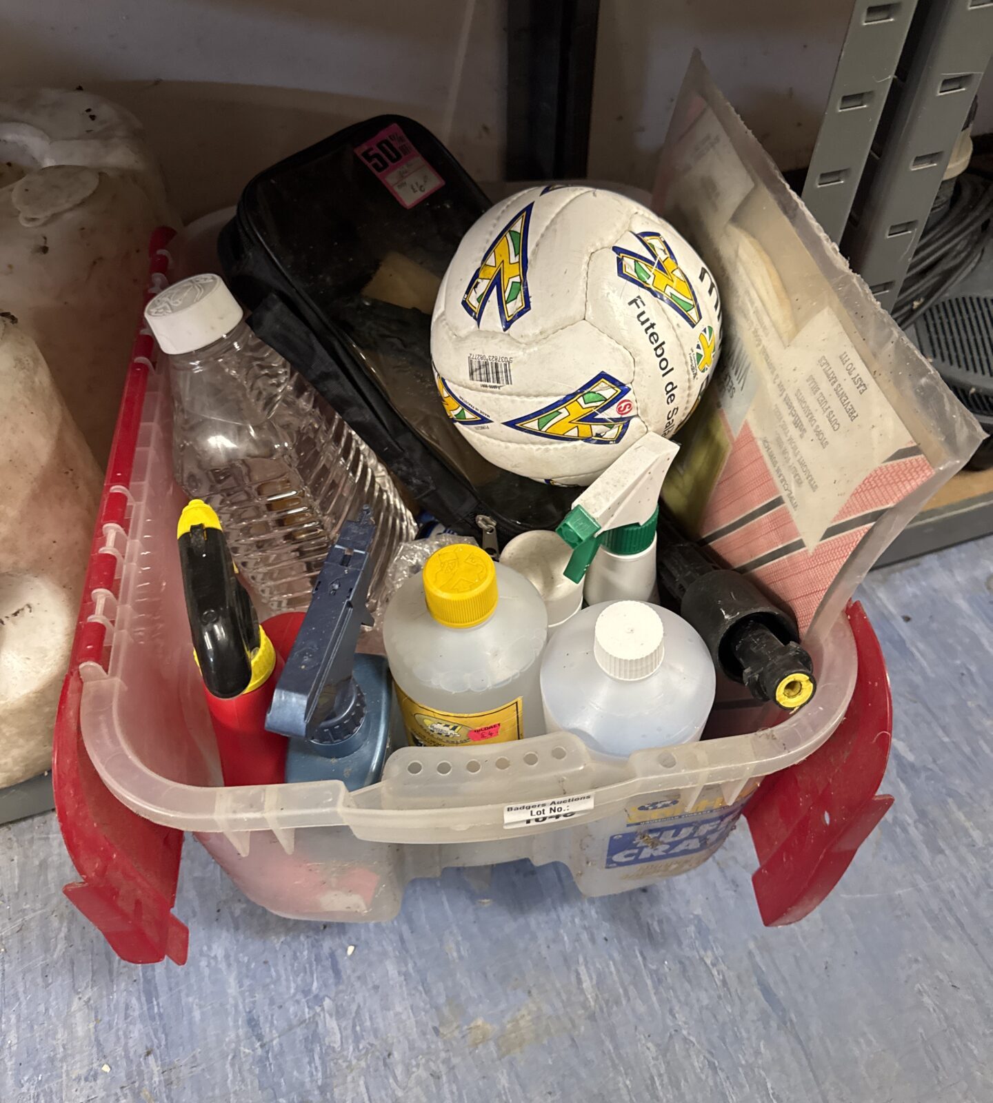 Shed clearance lot with garden chemicals and a Mitre football.