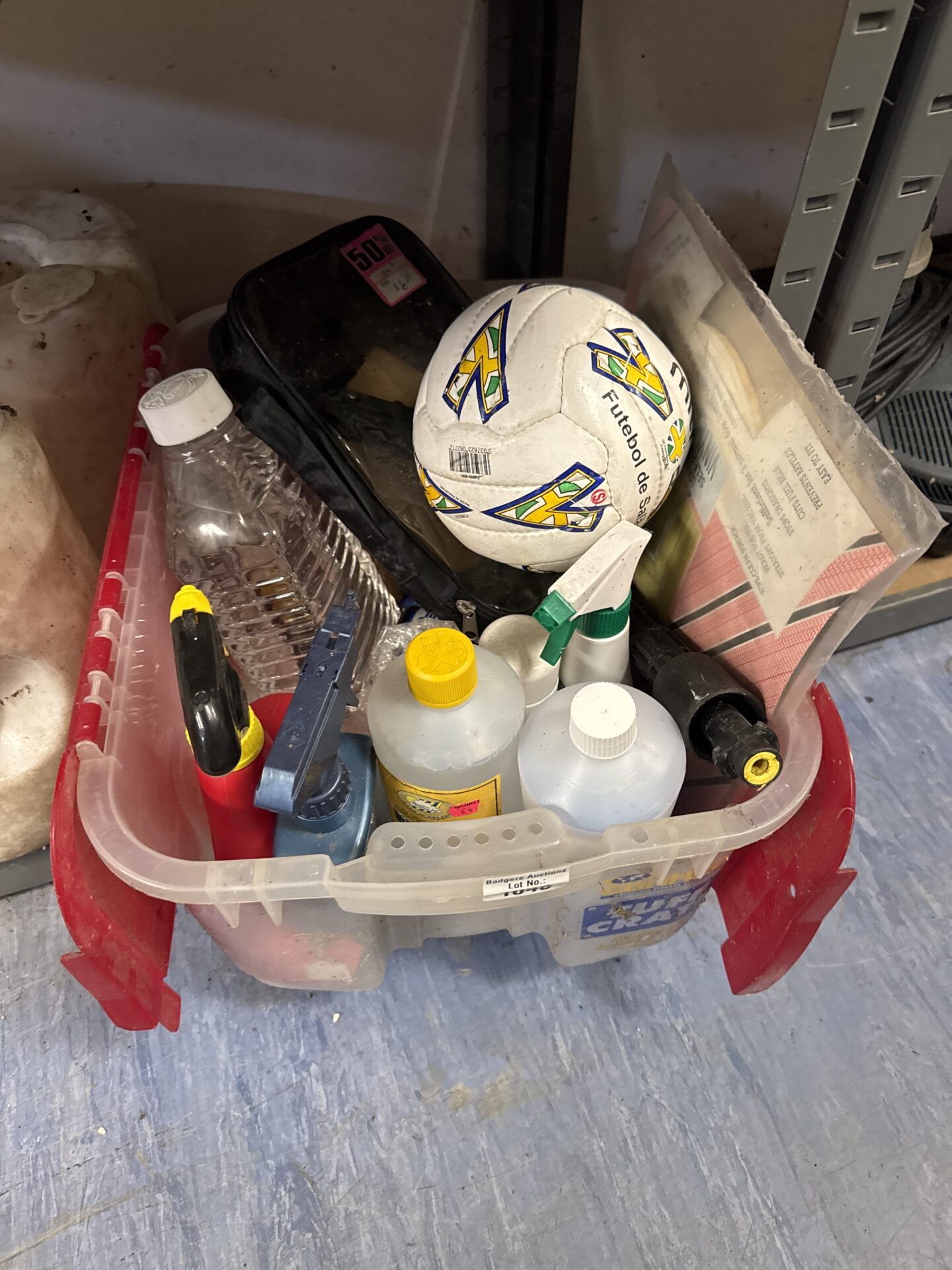 Shed clearance lot with garden chemicals and a Mitre football.