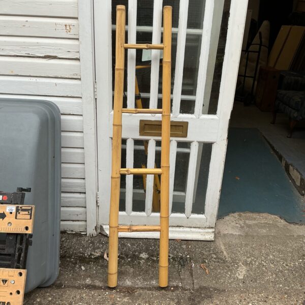 Vintage short bamboo ladder for rustic home or garden decor.
