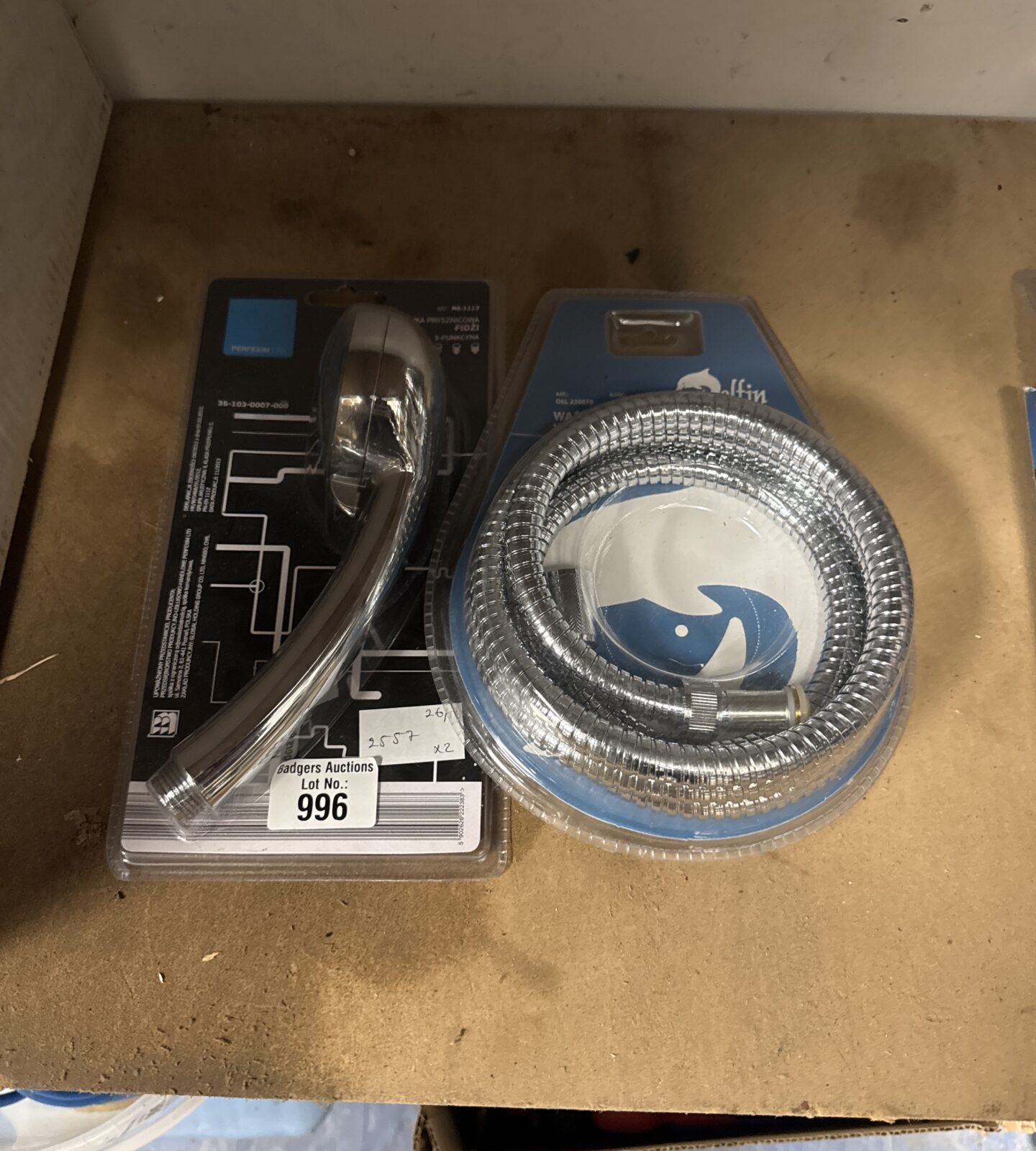 New shower head and hose set in original packaging.