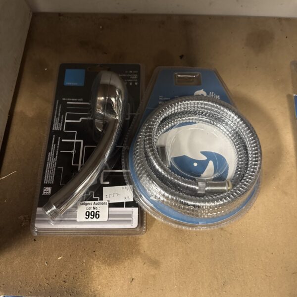 New shower head and hose set in original packaging.