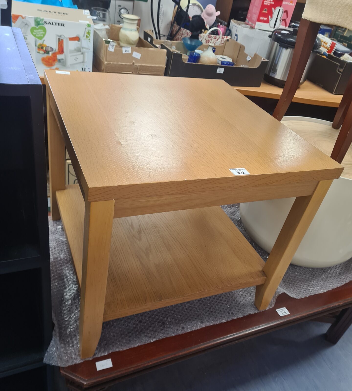 Light wood effect side table with a beach aesthetic.