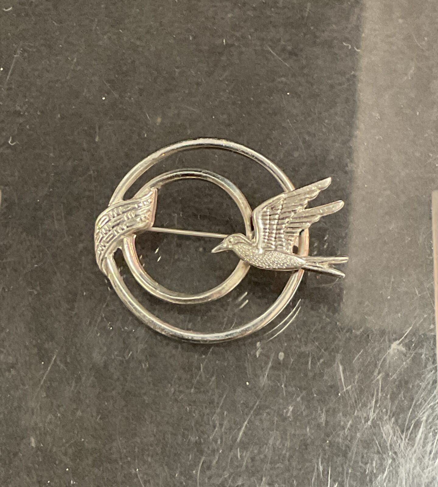 Vintage silver swallow brooch with delicate detailing.