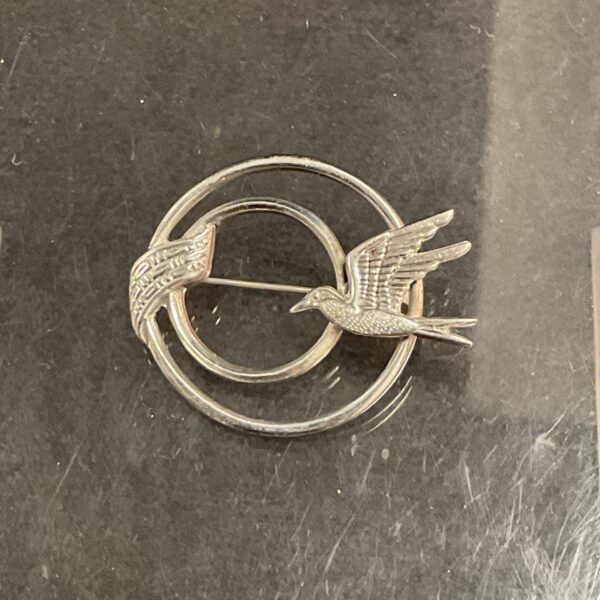 Vintage silver swallow brooch with delicate detailing.