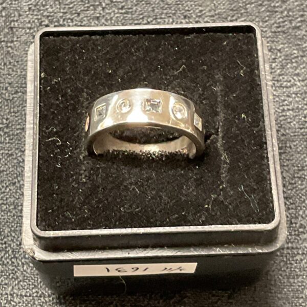 Silver ring with topaz and white stone, size M.