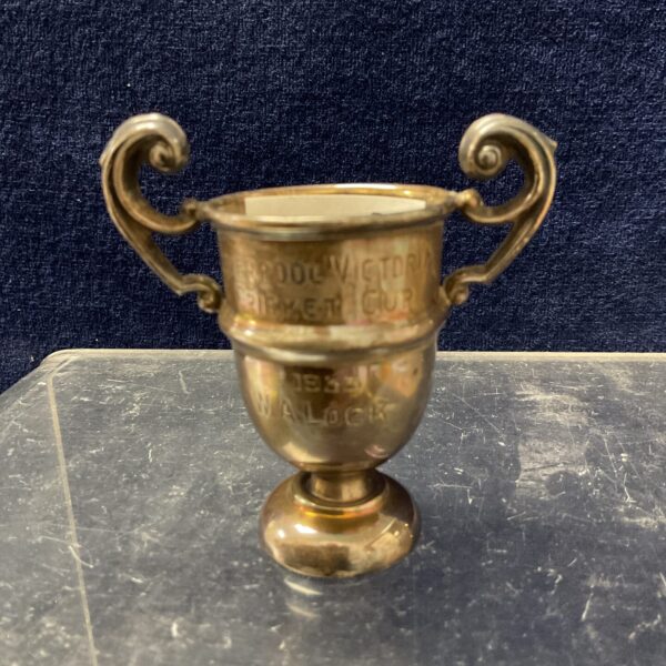 Antique silver trophy cup engraved 1933, a collectible silver item.