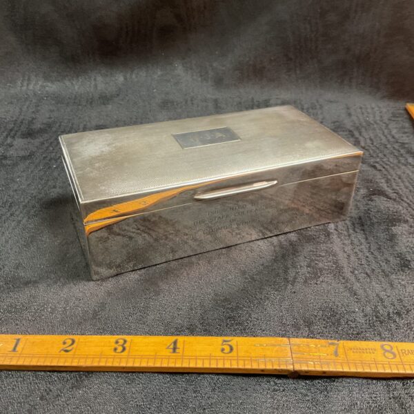 Vintage silverplate cigarette box with engraved dedication on top.