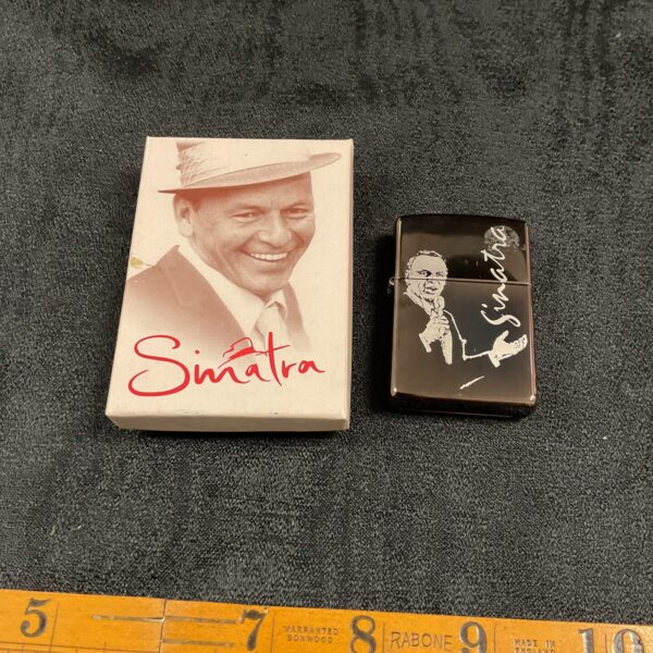 New Sinatra Zippo lighter in original packaging, collectible item.