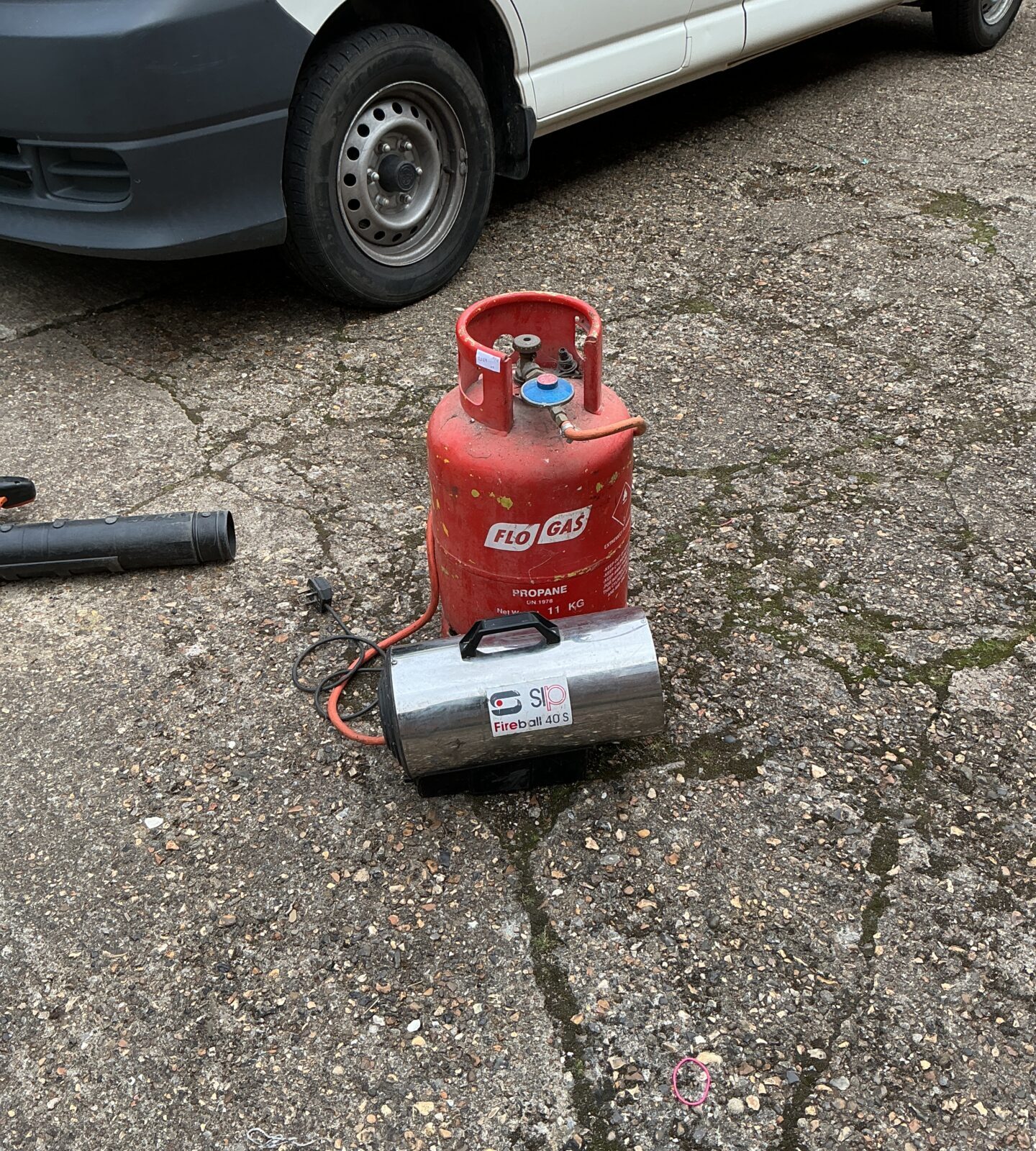 SIP space heater with full gas bottle for workshop or outdoor use.