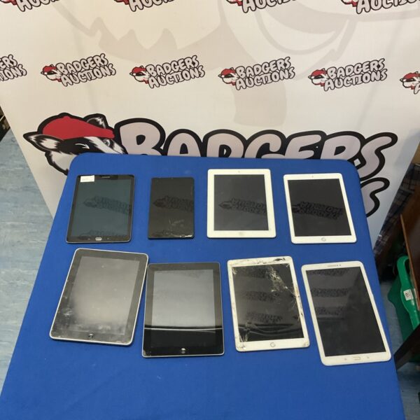 Group of eight used smart tablets including Apple iPads and Samsung.