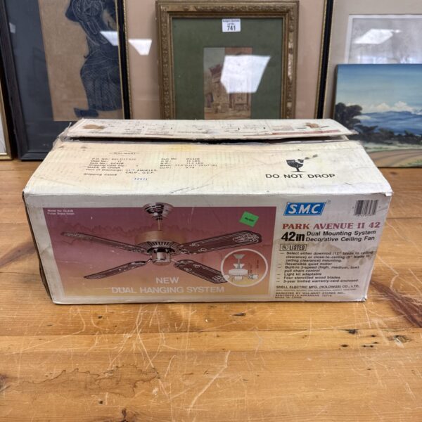 Front view of new-in-box SMC Park Avenue II ceiling fan.