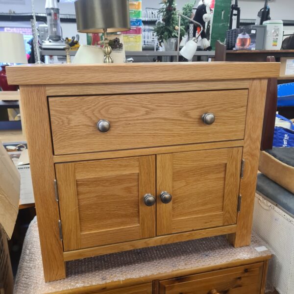 Vintage solid oak side cabinet with a single drawer.