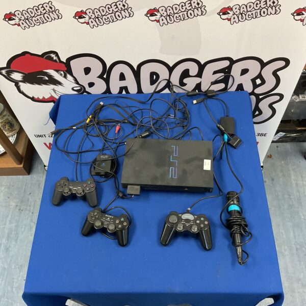 Sony Playstation 2 console with controllers and Singstar microphone.