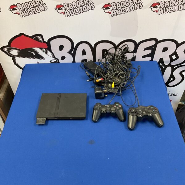 Sony Playstation 2 console with two controllers for retro gaming.