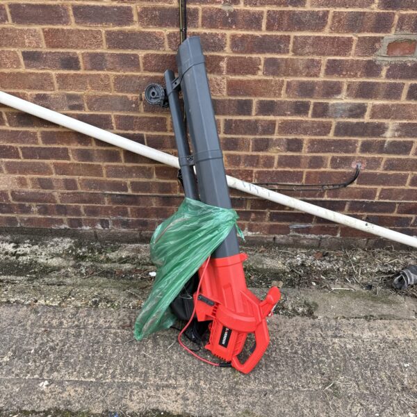 Red Sovereign garden leaf blower and vacuum for clearing leaves.