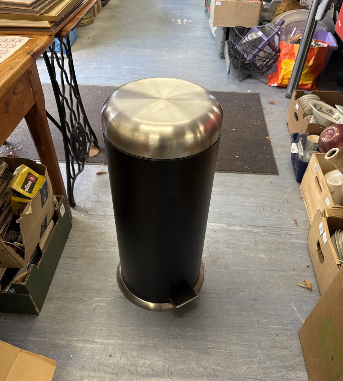 Stainless steel kitchen pedal bin for hygienic waste disposal.