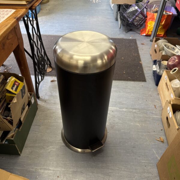 Stainless steel kitchen pedal bin for hygienic waste disposal.