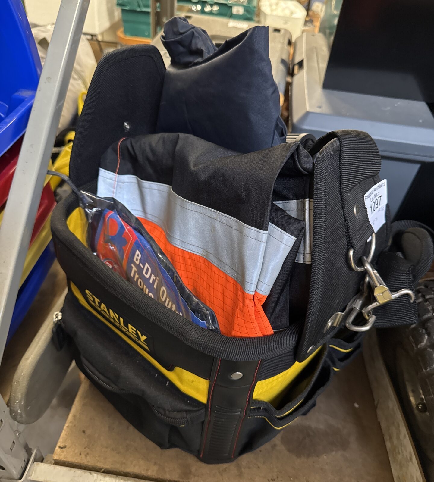 Stanley Fatmax tool bag with high visibility clothing inside.
