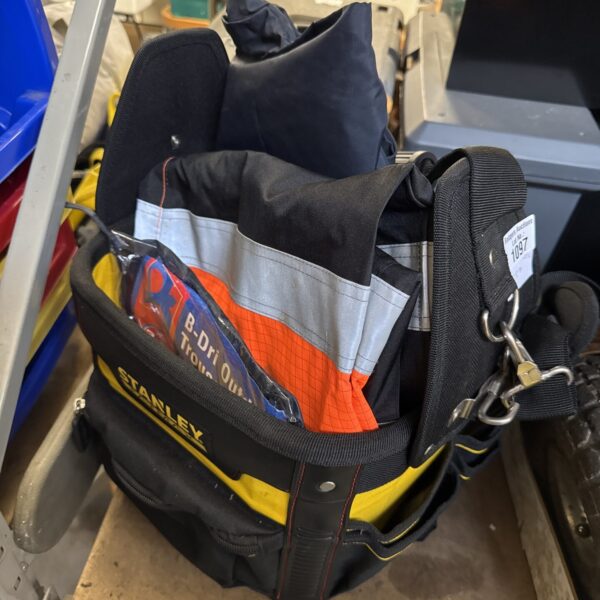 Stanley Fatmax tool bag with high visibility clothing inside.