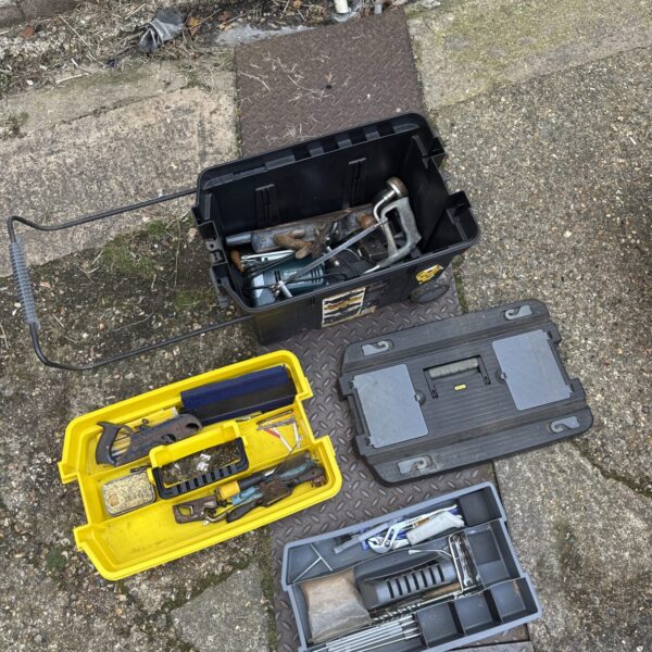 Stanley wheeled tool chest filled with various tools and storage compartments.