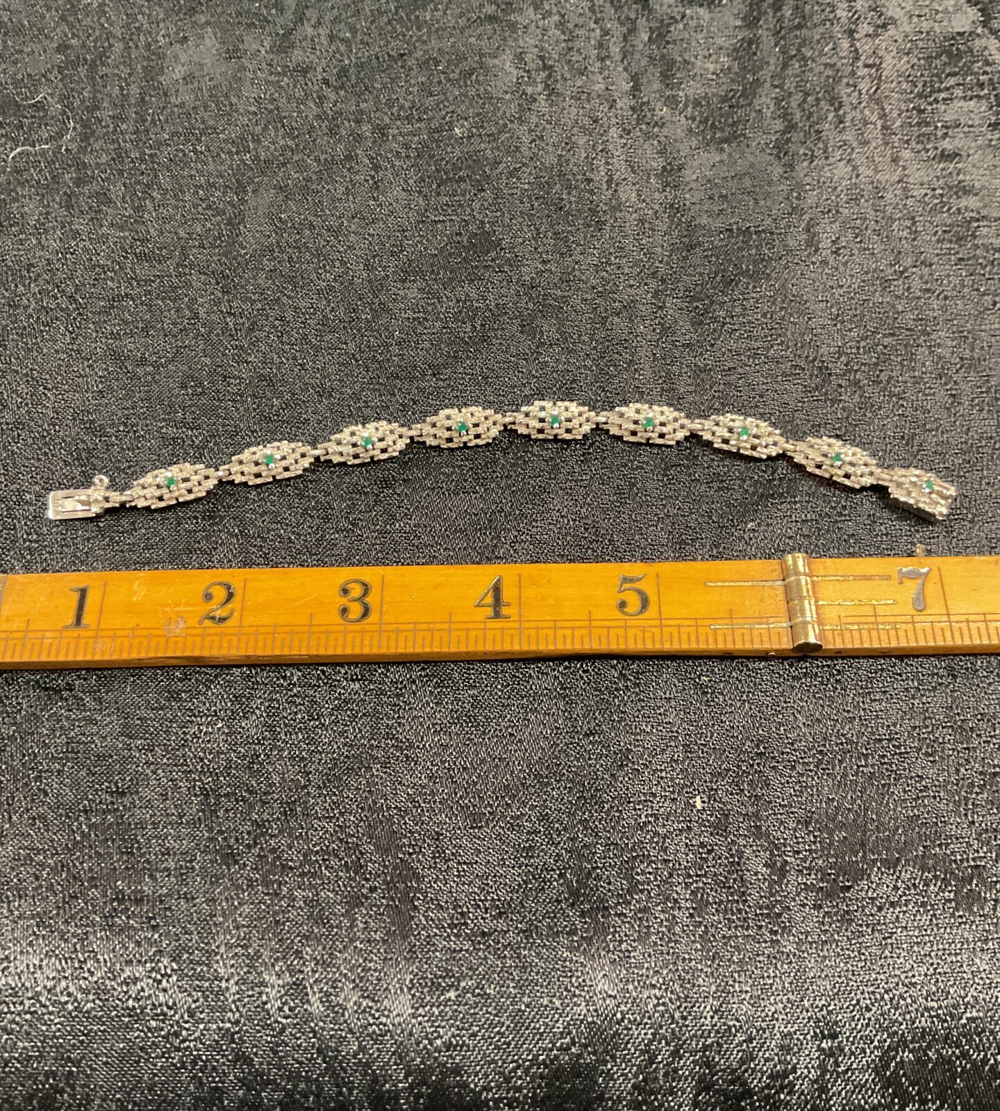 Vintage sterling silver bracelet with green stones.