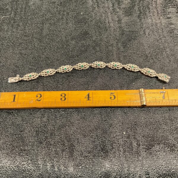 Vintage sterling silver bracelet with green stones.