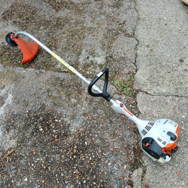 Used Stihl FS40 petrol strimmer for garden maintenance.
