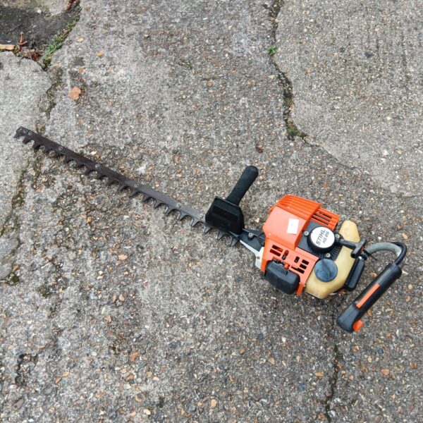 Stihl HS85 petrol hedge cutter for garden maintenance and landscaping.