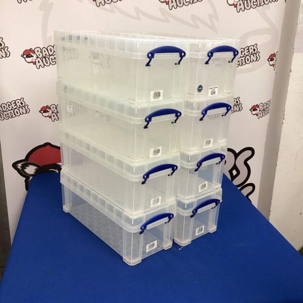 Lot of eight plastic storage boxes for home organisation.